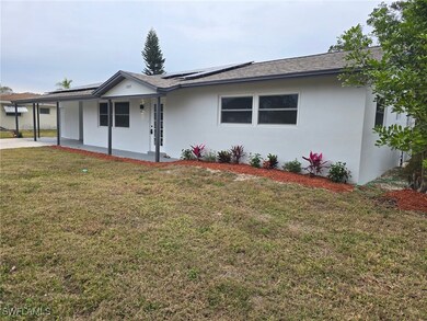 Ranch-style home featuring a front yard