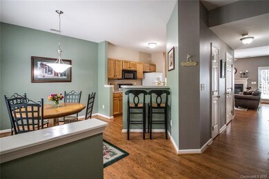 Foyer looking into eat-in-kitchen, kitchen and hal