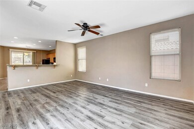 Unfurnished living room featuring baseboards, ceil