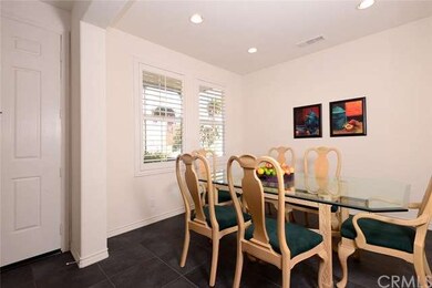 The spacious dining room has plenty of room for a 
