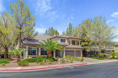 View of front of property featuring driveway, stuc