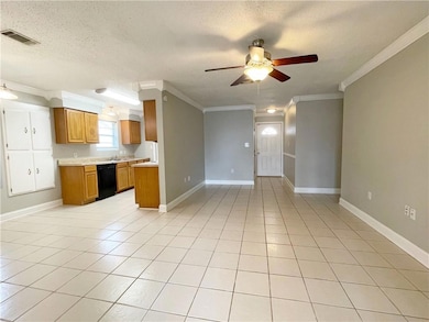View of Living Room, Foyer and Kitchen from the De