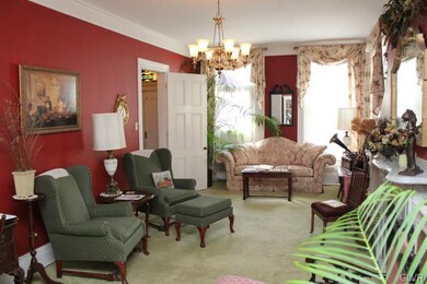 This exquisite parlor boasts 10' ceilings, 9' 3-pi