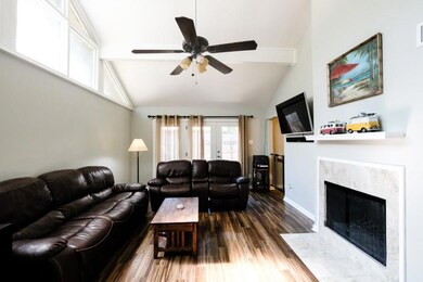Wood burning fire place. French doors open to spac