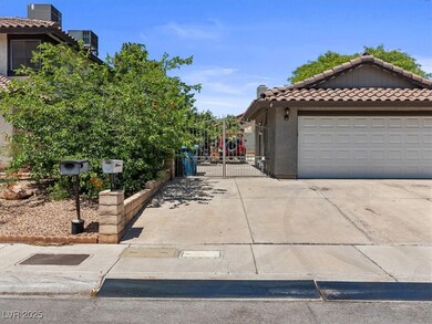 View of home's exterior featuring a gate, a tiled