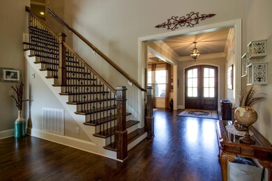 4 foot wide stair case with wrought iron rail