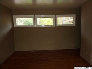 The triple windows on the other side of the living
