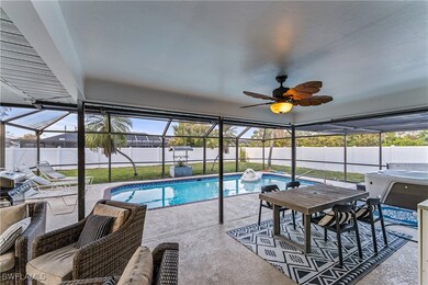 View of swimming pool with ceiling fan, a patio ar