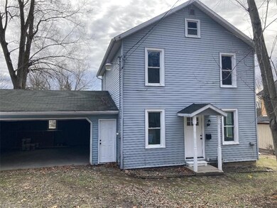 Front with man door to garage