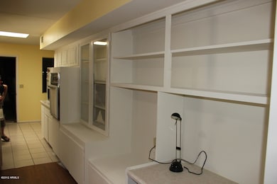 Built in shelves extended to the kitchen