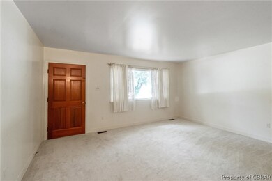 Empty room with carpet floors