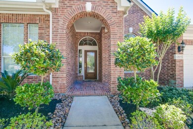 Inviting entrance is beautifully landscaped!