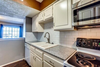 Neutral cabinets and granite countertops in the ki