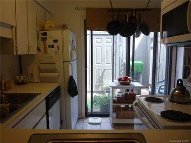 Kitchen Overlooking Enclosed Private Patio