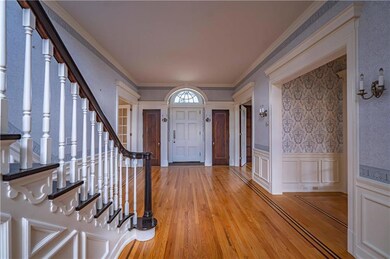ENTRY FLANKED BY 2 COAT CLOSETS WITH WALNUT INLAY 