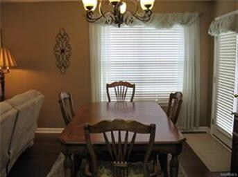 Dining room off the kitchen with doors to covered 
