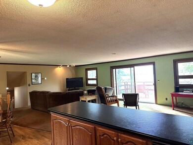 Interior space with a textured ceiling and crown m