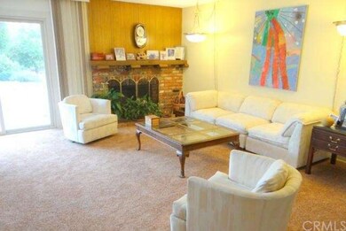 Light and bright living room with cozy brick firep