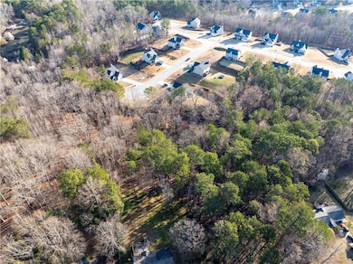 Drone / aerial view with a wooded view