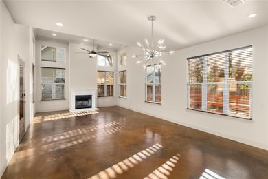 Unfurnished living room featuring visible vents, 