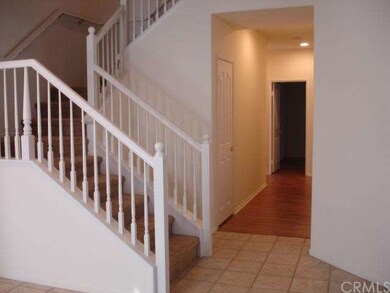 Hall entry with stairs leading to bonus master bed