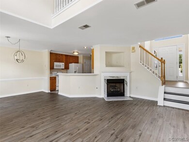 Living room with new vinyl floor and gas fireplace
