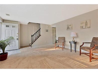 Bright and spacious living room with new carpet.