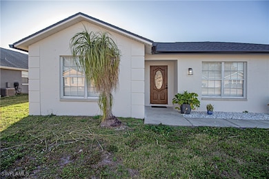Single story home with a front lawn and central ai