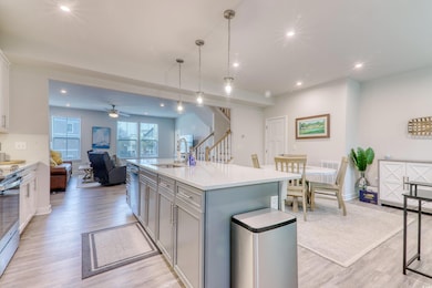 Kitchen featuring a sink, light wood-style floors,