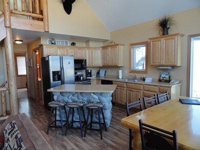 Kitchen with center island and SS appliances.