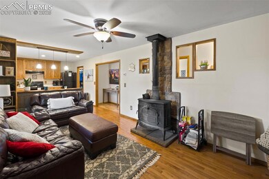 Cozy and inviting, the living room centers around a wood-burning fireplace—perfect for cool mountain nights.