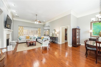 Living area with baseboards, ornamental molding, c
