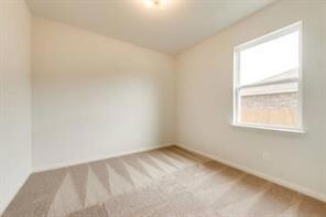 Unfurnished room featuring carpet floors