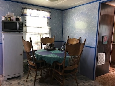The kitchen has room for family to sit down and enjoy a meal together.
