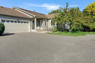 Wonderful end unit townhome with front sitting area.