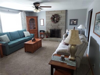 Living room w/gas log fireplace.