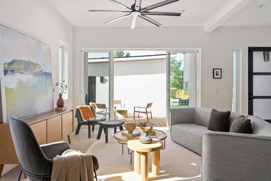 Living room featuring beamed ceiling