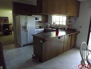 Kitchen, with pass-through to dining room.