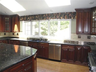 Granite Kitchen with 2 Dishwashers & 2 Skylights.