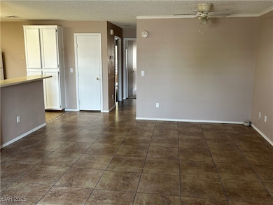 Unfurnished room with a textured ceiling, a ceilin