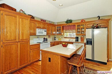 Plenty of cabinets, island with eating bar