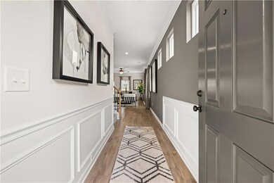 Hallway with light hardwood / wood-style flooring 