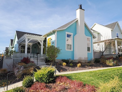 View of property exterior featuring a chimney and a shingled roof