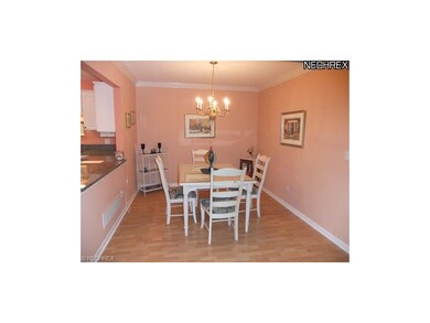 The dining room is open to the great room. Crown m
