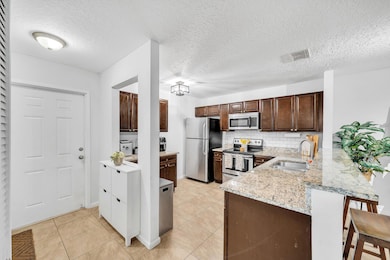 1627 Woodbridge Lakes Cir, West Palm Beach, FL 33406 - photo 7