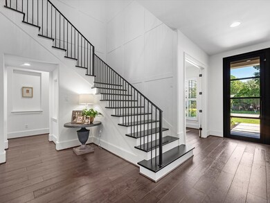 Upon entering the home, the grand staircase ascend