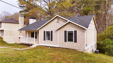 View of front facade featuring a front yard, a shi