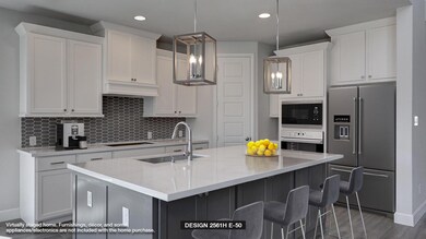 Kitchen with high end fridge, wall oven, a sink, 