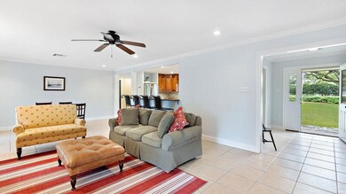 View of living room looking through front yard wit