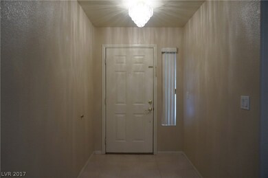 Front door and tiled entry way